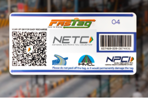 A car passing through a toll booth with FASTag